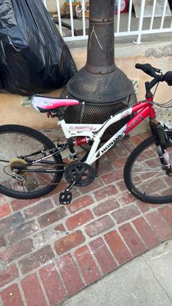 • Brand/Model: Honda Racing Z-Moto 2.4 • Type: Dual-suspension mountain bike • Key Features: Red and white color scheme, front suspension fork, and ce