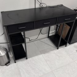 Black wood desk with drawers
