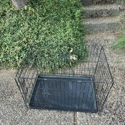 Folding dog cage  25in H x 22.5in D x 35in W