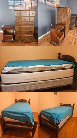Bed (box spring, bed frame, mattress, foam mattress topper),  chested drawer,  and a nightstand