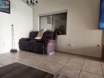 Bbq With 2 Propane Tanks And A Recliner Love Seat