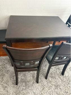 Dark wood dinner table