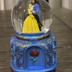 Collectible beauty and the beast snow globe. 