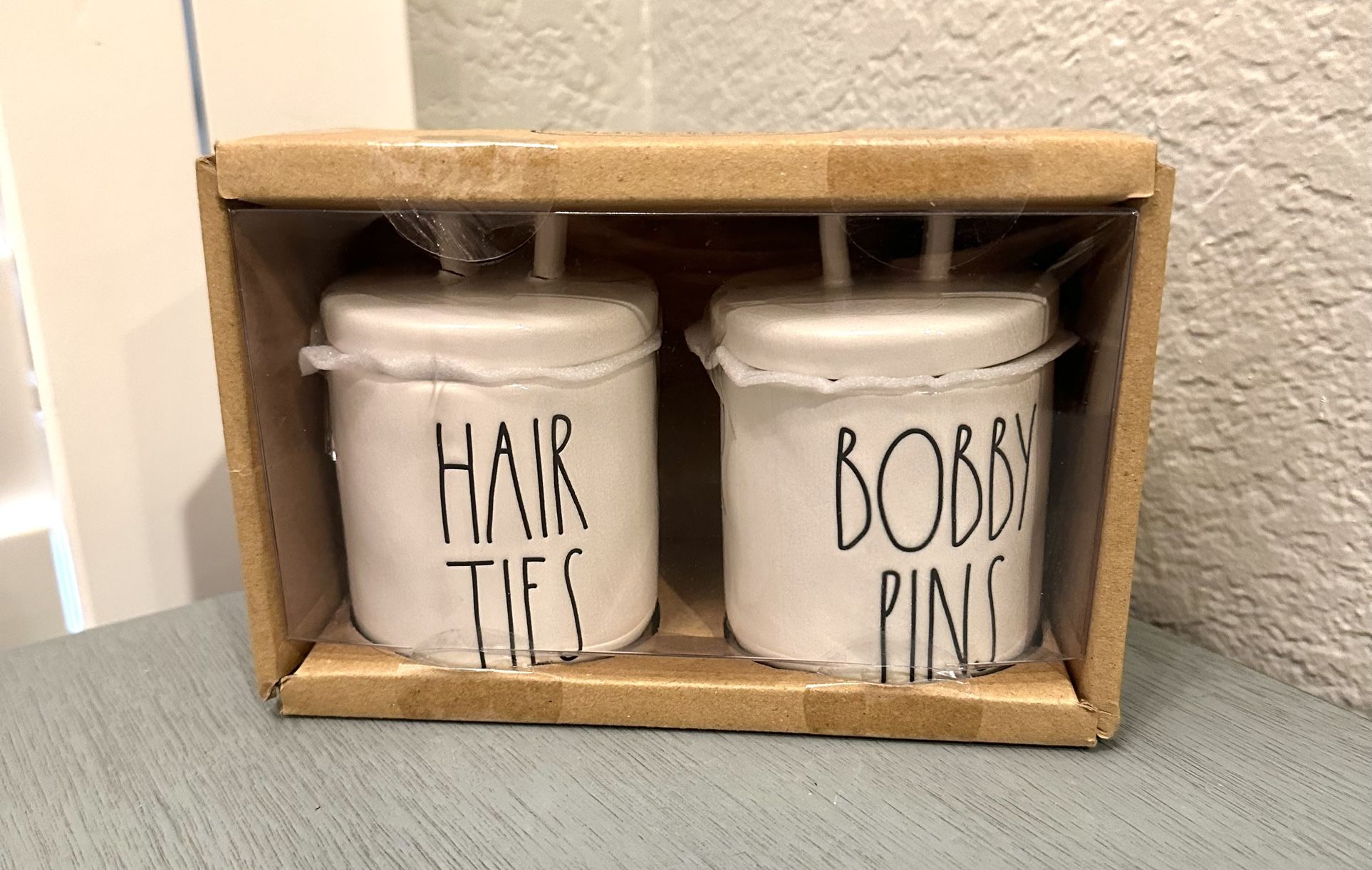 $15…New Rae Dunn set of white HAIR TIES & BOBBY PINS small ceramic looped lid canisters. Please pickup in the area of 36th Ave and Pinnacle peak with