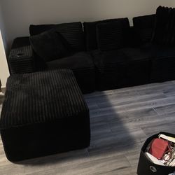 black living room L-shape couch