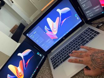 with attachment with two extra screens HP laptop with attachment with two extra screens