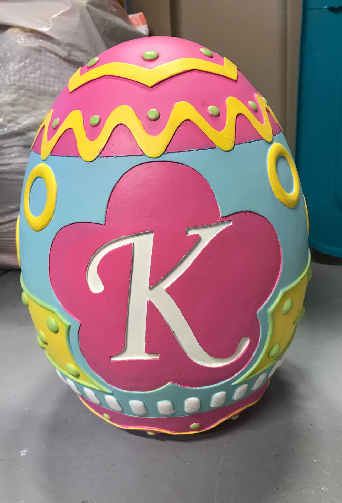 Big ceramic Easter egg with the letter “K” on it
