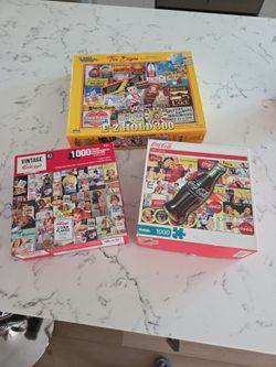3 PUZZLES COCA-COLA, VINTAGE KELLOGG'S, VINTAGE TIN DESIGNS SEE DESCRIPTION