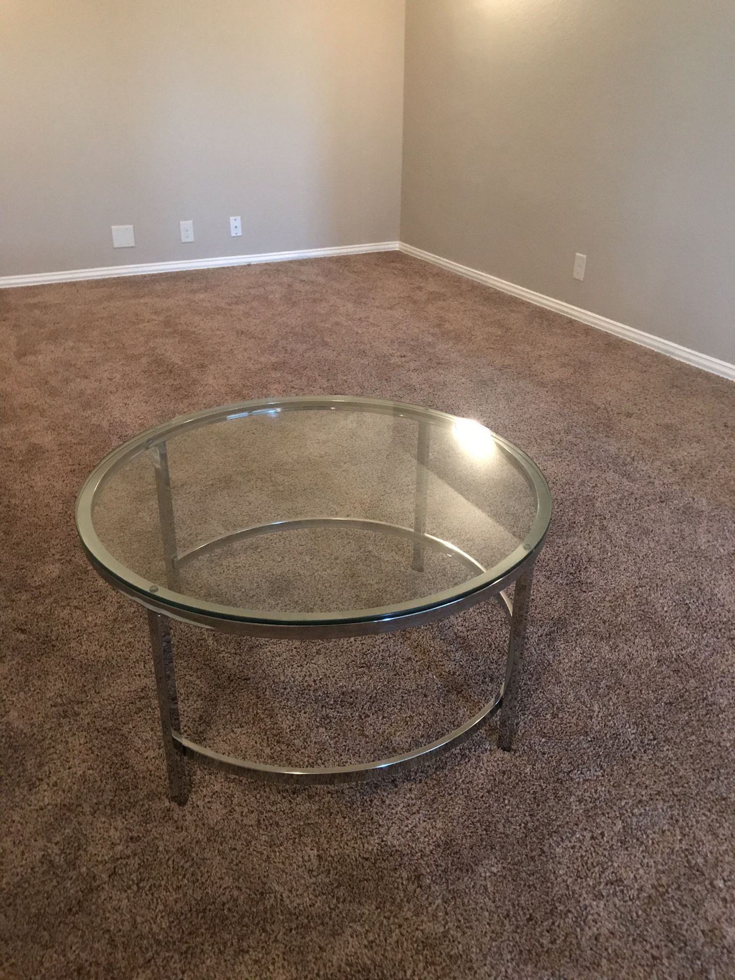 Glass coffee table, with metal frame.