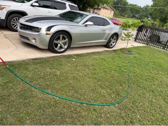 2011 Camaro, 3.6L, gray; cloth seats. It features a new fuel pump and a new A/C compressor. The paint has some minor cosmetic flaws, but the engine an