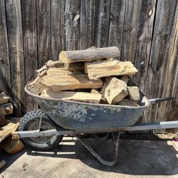 A Wheelbarrow Of Firewood For $20. Wheelbarrow Not Included