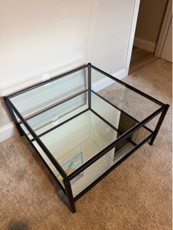 Glass coffee table with storage