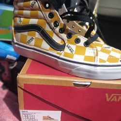 Yellow gold and white checkered vans  high tops