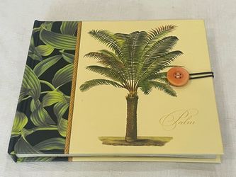 Tommy Bahama tropical palm tree themed photo album holds 20 photos.