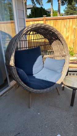 Origin 21 Dunes Wicker Brown Steel Frame Stationary Egg Chair with Blue Cushioned Seat