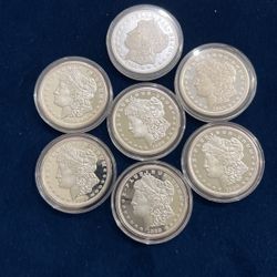 Morgan dollars (copies not silver) 7 pieces 