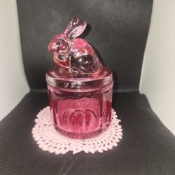 This item is a vintage pink trinket or candy dish.