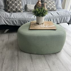 Green Color Fabric Ottoman/Coffee Table With Wheels.