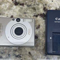 Canon PowerShot SD1000 7.1 MP Silver Digital Camera with OEM Battery & Charger