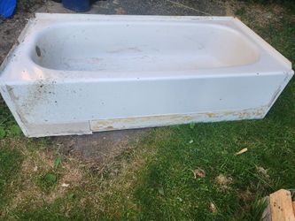 bathroom tub with surrounding walls