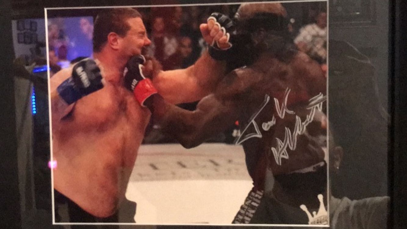 Framed Autographed Tank Abbott While Fighting Kimbo Slice 16 3/4”x 13 3/4”