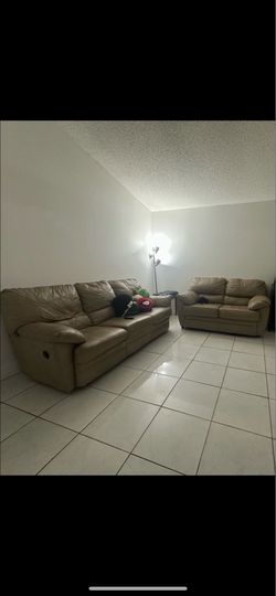 Reclining leather sofa and love seat beige