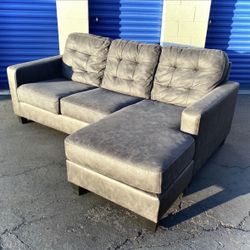 Gray Ashley HomeStores 85” Venaldi Sectional Sofa with Reversible Chaise