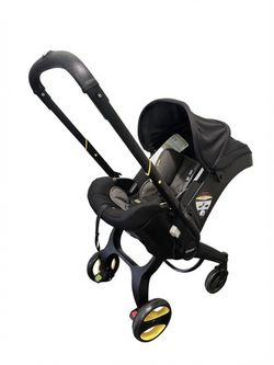 Doona Infant Car Seat & Stroller + LATCH Base + Storage Bag + Sunshade (Expires 9/2027)
