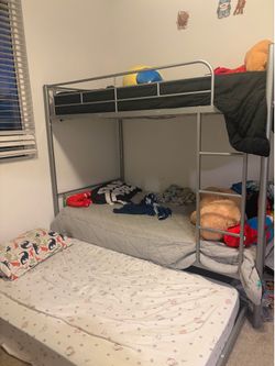 Grey bunk bed with trundle