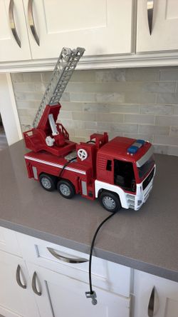 Driven by battat toy fire truck