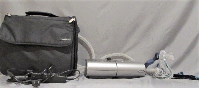 CPAP machine w/ bag, adapter, face mask, & hose