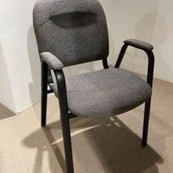 New chair gray color fabric upholstered.