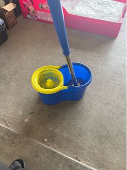Brand new mop bucket and mop handle.