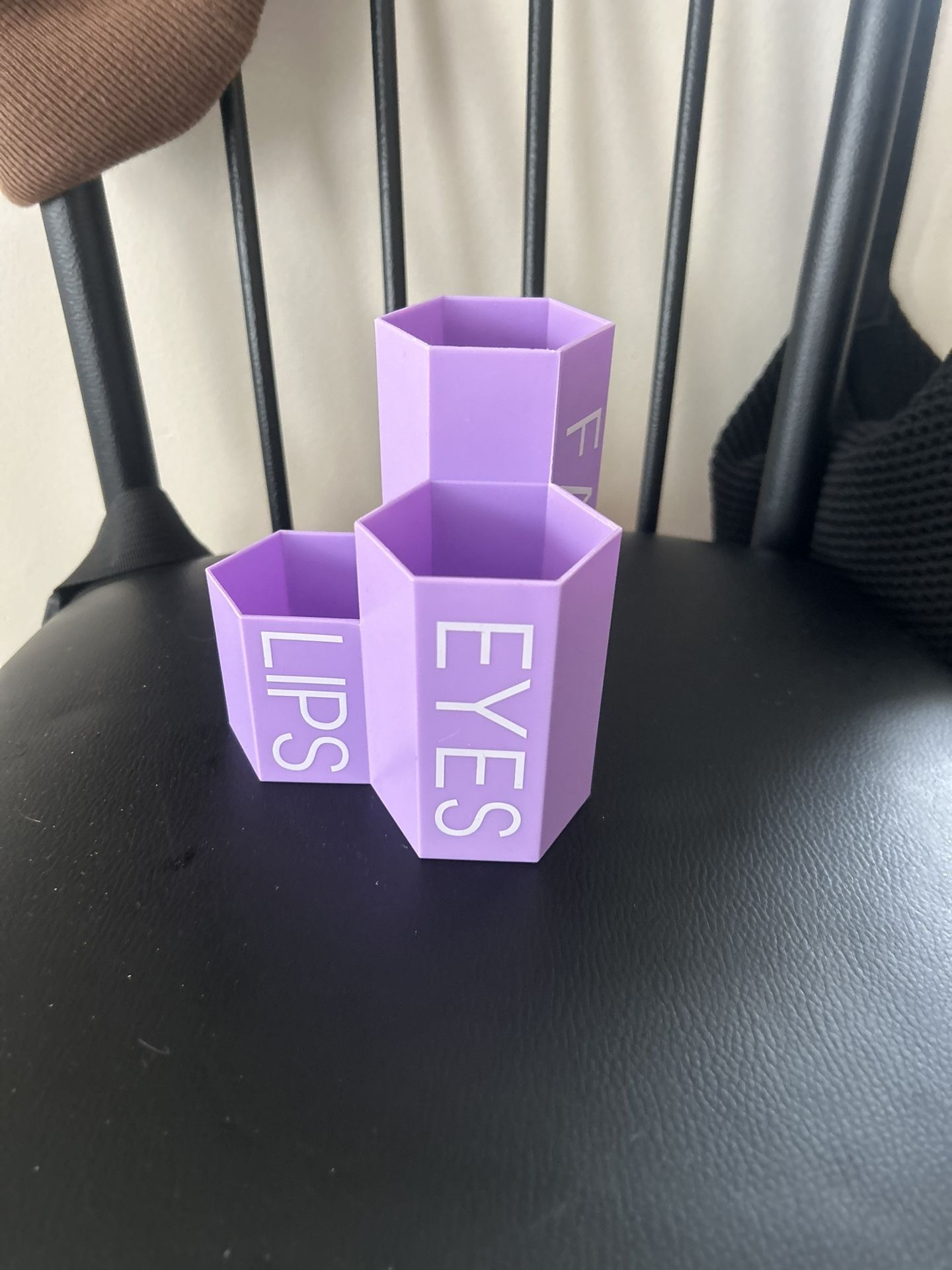 A set of three connected, hexagon-shaped containers