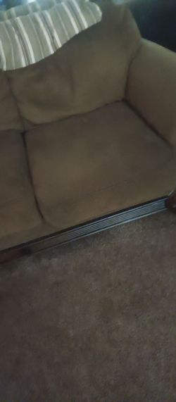 2 Ashley sofas dark green  almost brown