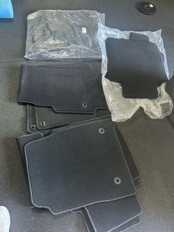 Carpeted floor mats. Various makes