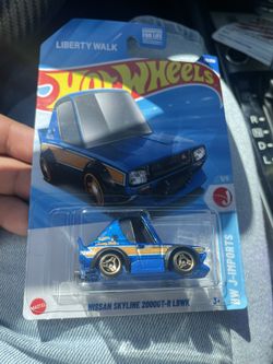 Hot Wheels Nissan Skyline 2000GT-R LBWK diecast car from the "Liberty Walk" series, part of the "HW J-Imports" line. 