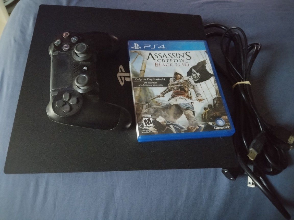 Sony PlayStation 4 Pro + remote, HDMI cord and Assassin's Creed game