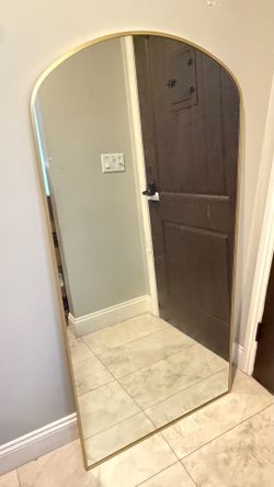 Floor length arch gold mirror