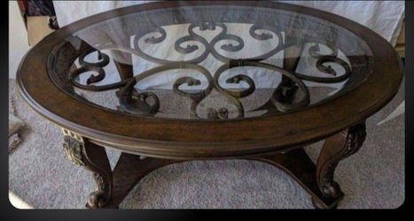 Wood Coffee Table with a glass inset and decorative metal
34"D x 20.25"H x 48"W