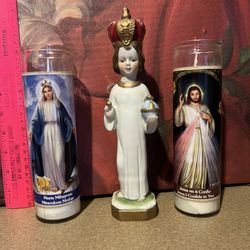 Infant Of Prague Statue And Religious Candles