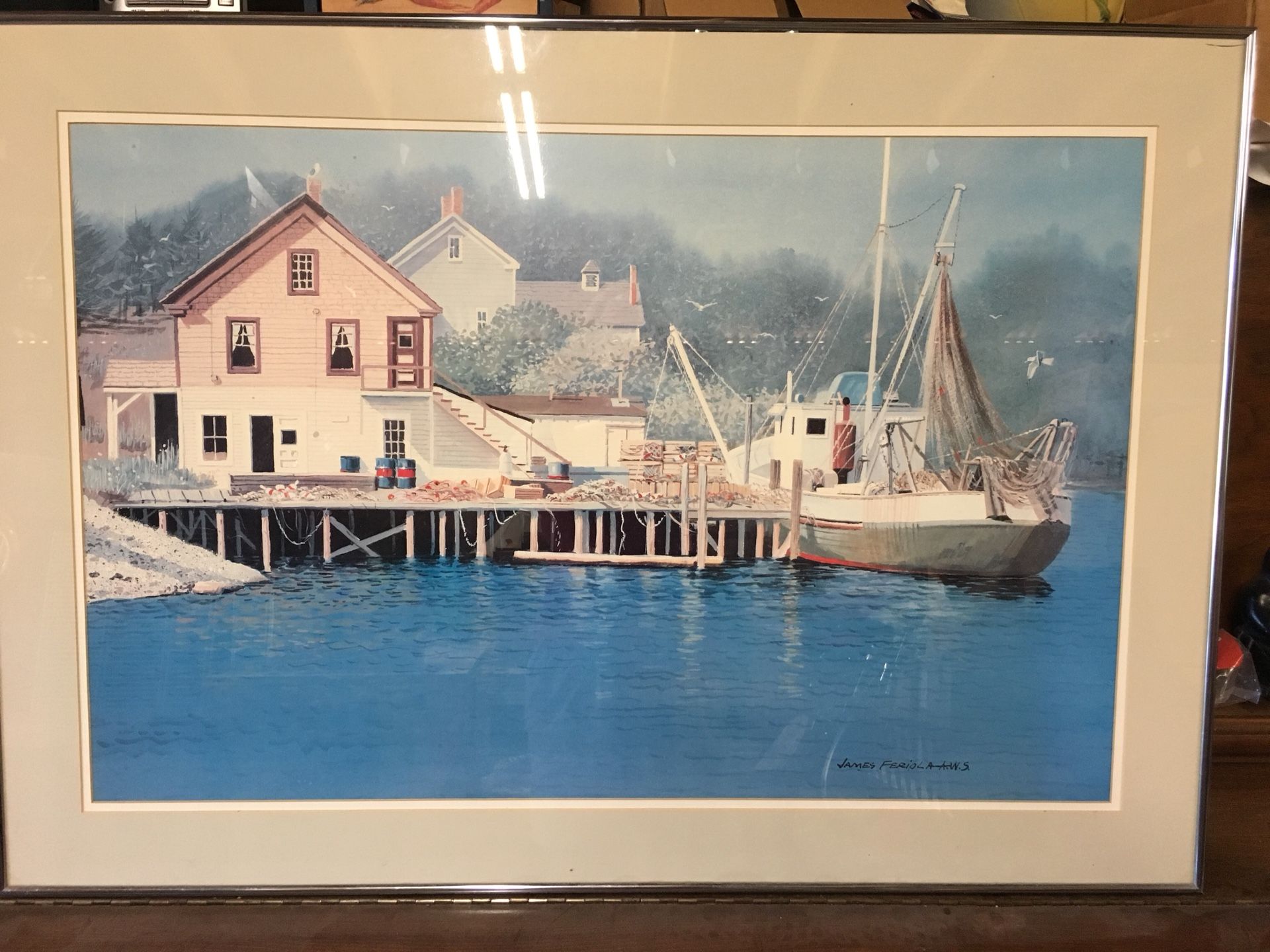 Sailboat and Cottage Framed Print