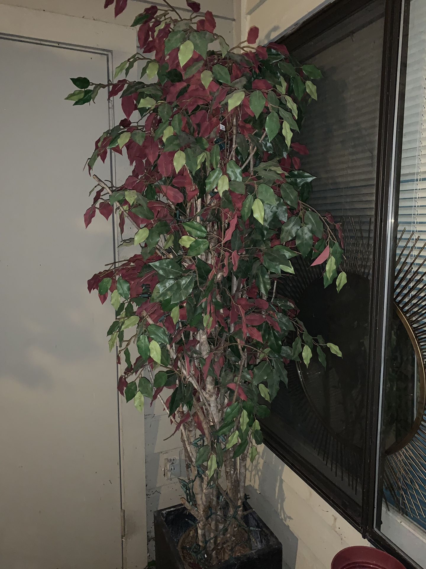 Fake tree comes with basket but not the black planter pot