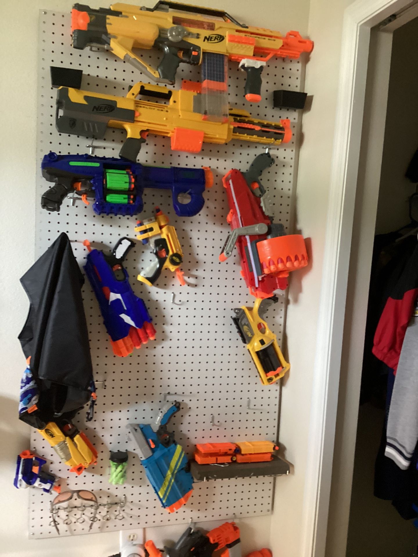 Nerf Wall With Hooks, Mags, 200 Plus Bullets And 12 Nerf Guns, And