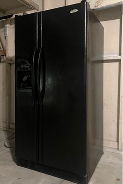 Whirlpool great working side-by-side refrigerator freezer