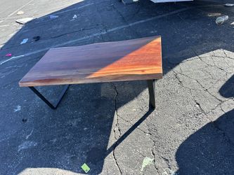 wood coffee table with modern black metal legs.  