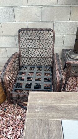 Beautiful wicker outdoor swivel chairs with cushions and matching table brand new.