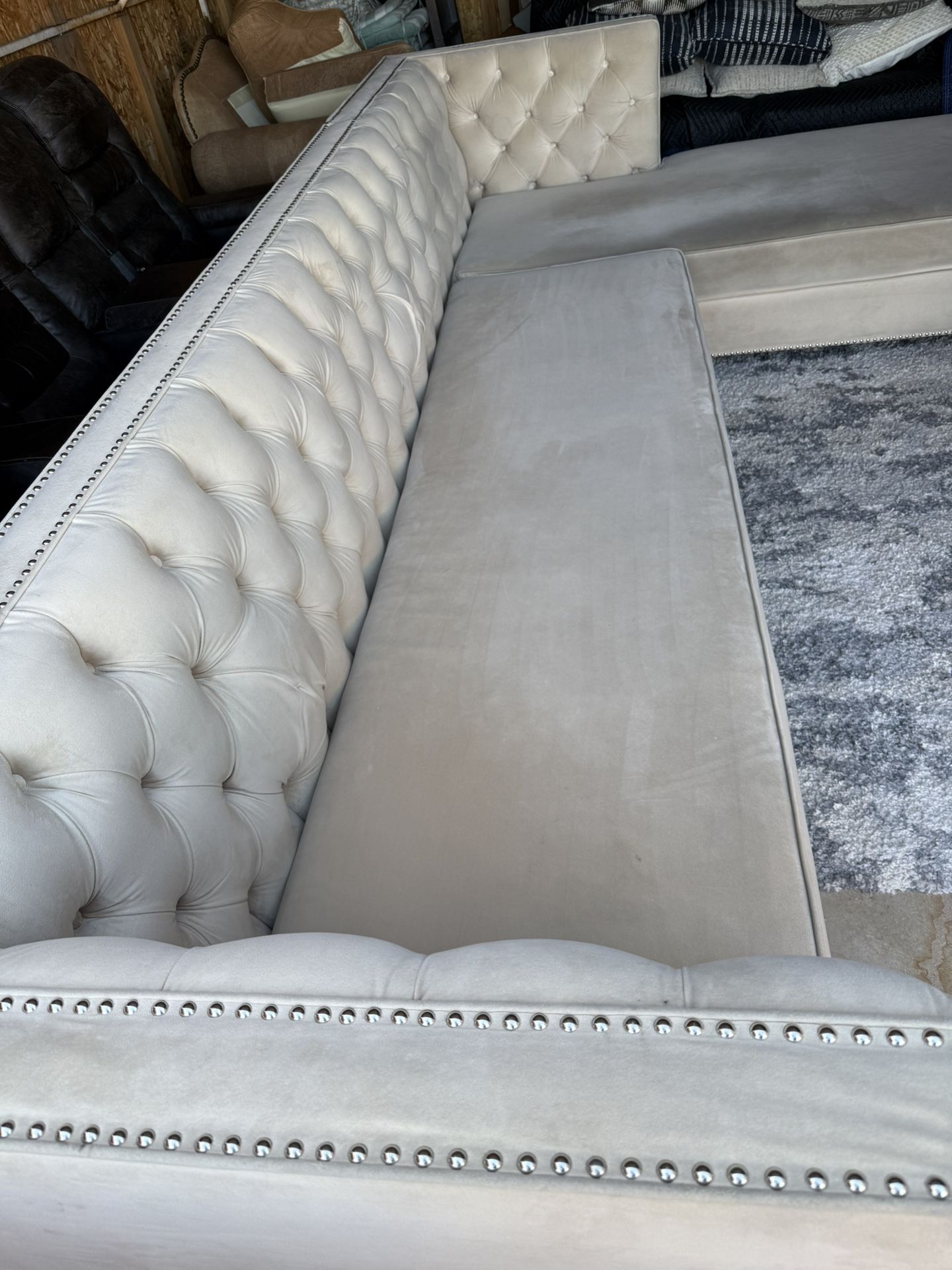 tufted, L-shaped sectional sofa with a chaise lounge. *champagne color*