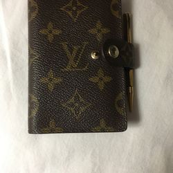 Vintage Louis Vuitton address book with pin you can buy refillable address in Calendar I have the receipt it was bought in 1991