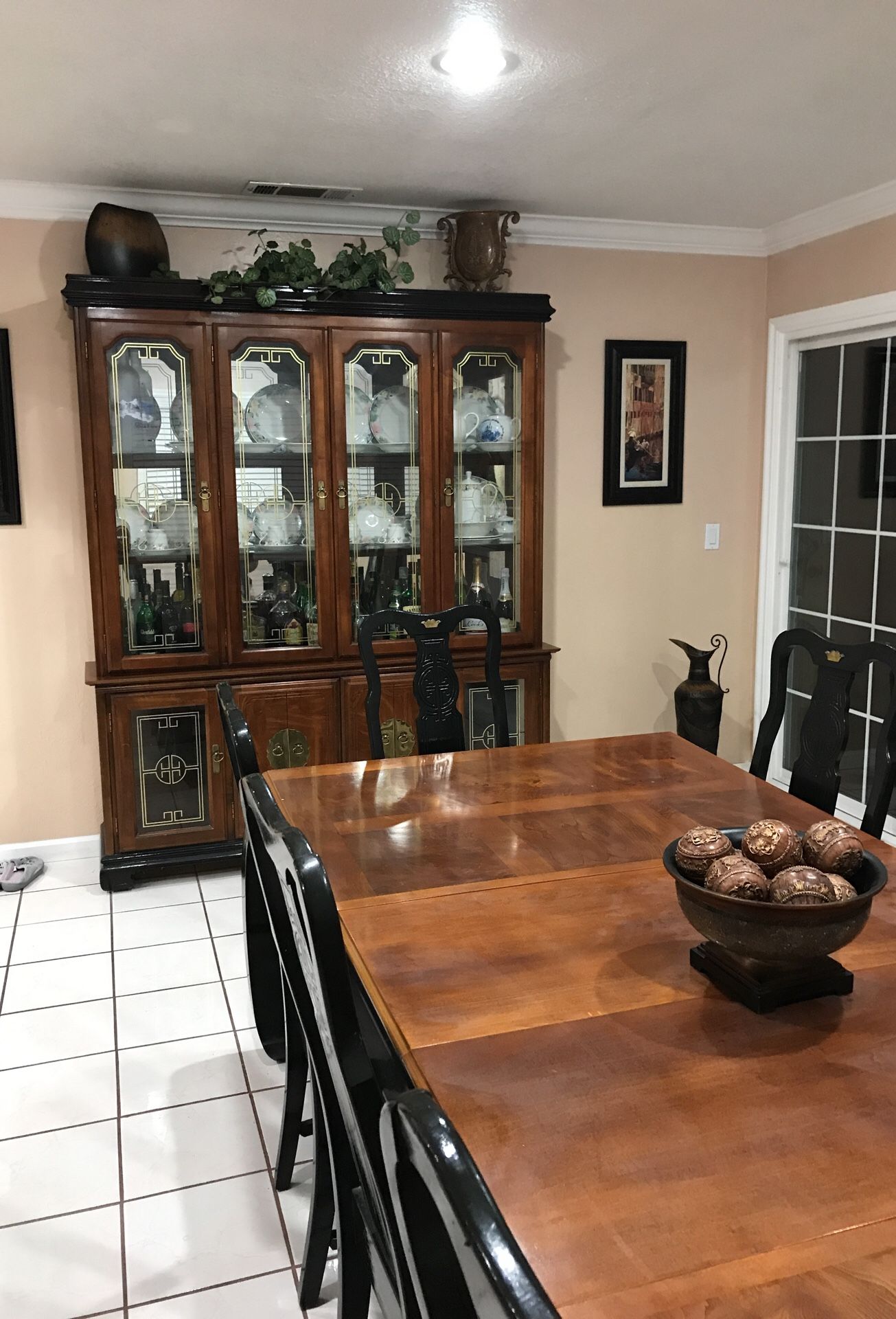 China cabinet and dining table with eight chairs